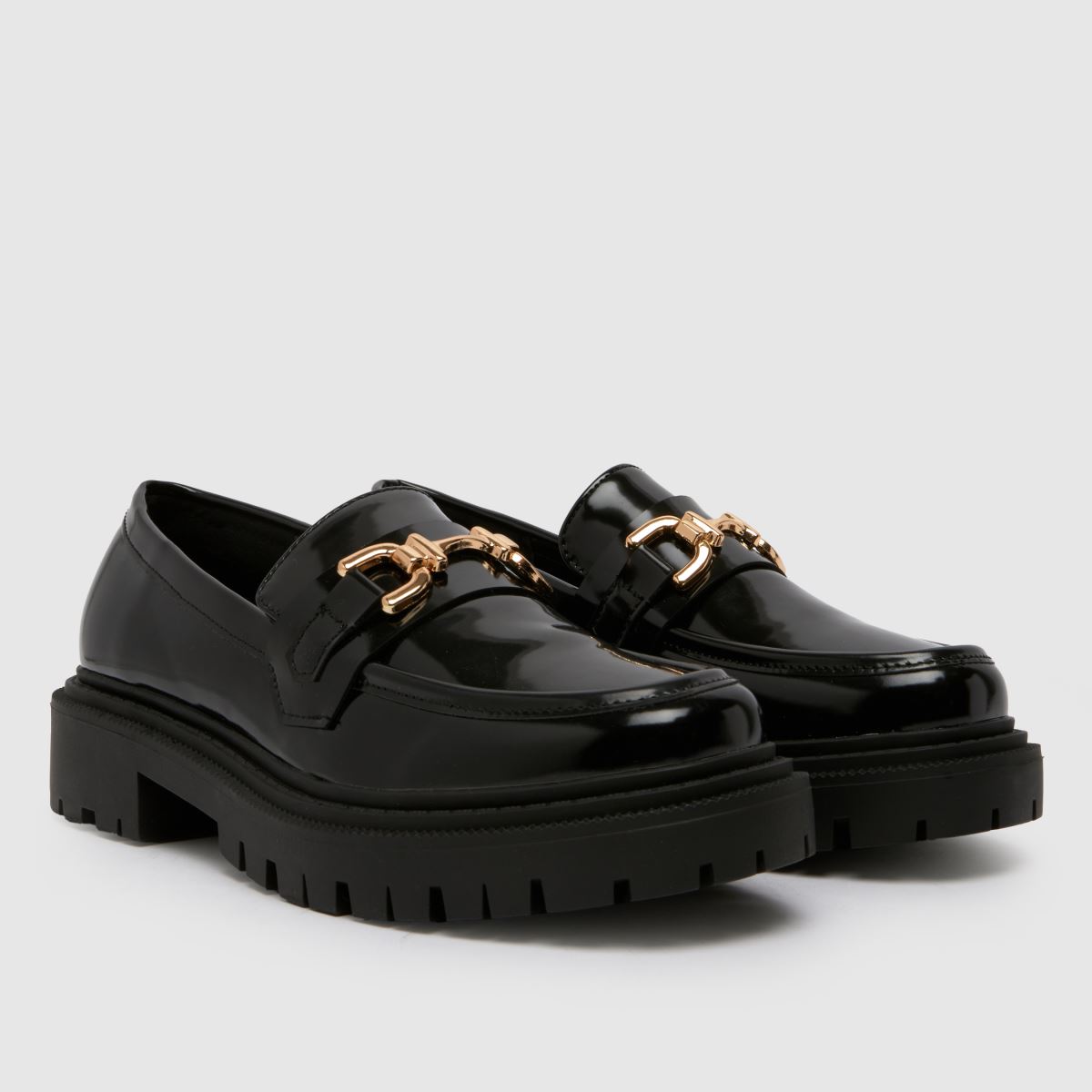 Schuh – Svarta, platta loafers med bred passform och snaffle-motiv