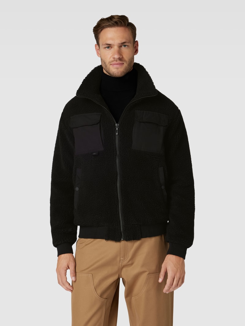 Jacke mit Stehkragen und Brusttaschen in schwarz