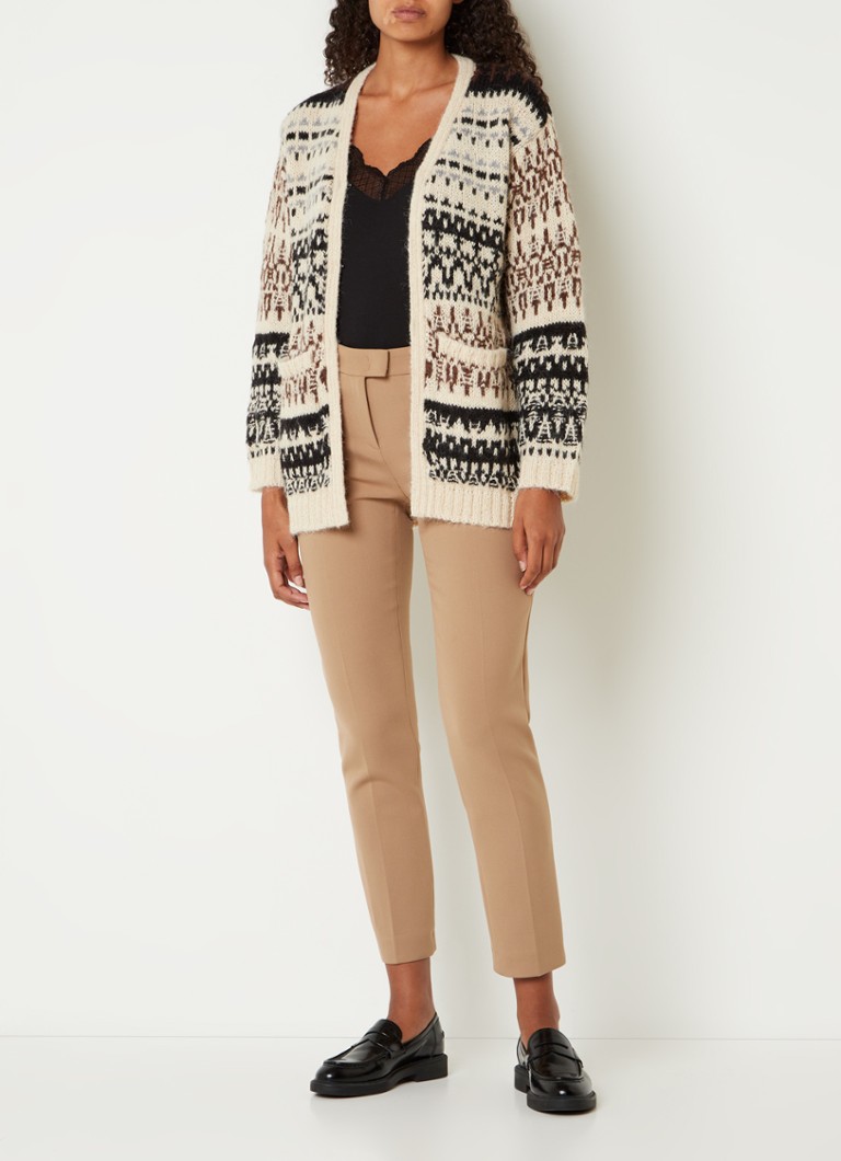 Un cardigan cu o cusătură macabră de la Gerard Darel Louison, confecționat dintr-un amestec de lână și cu un model integrat.