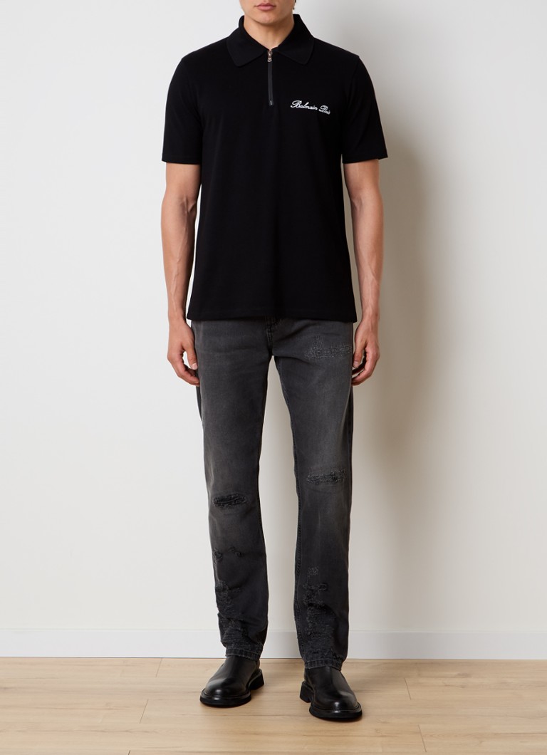 Polo Balmain Signature, vestibilità classica, mezza zip e logo ricamato.