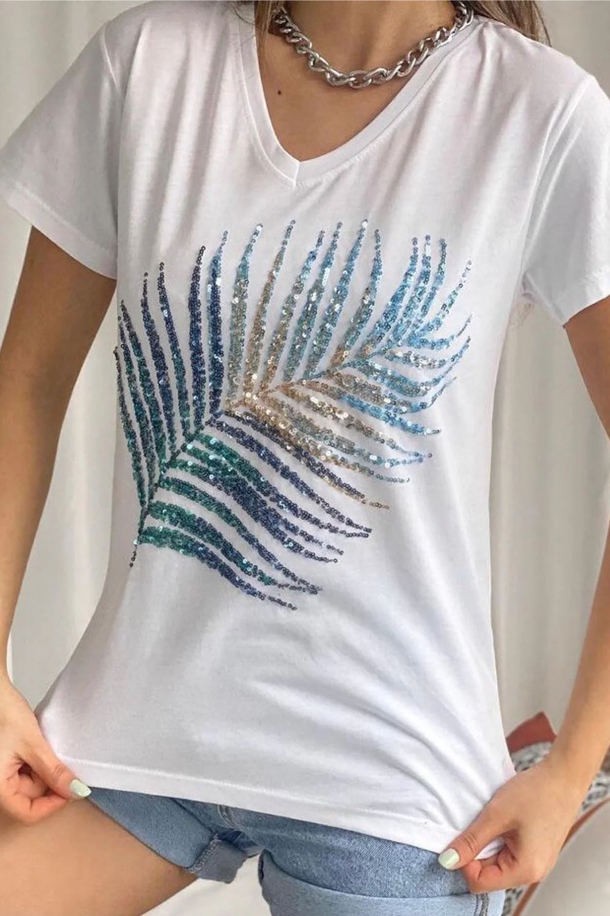 FEMELLE  Weißes Damen-T-Shirt aus Baumwolle mit V-Ausschnitt und Blatt-Pailletten