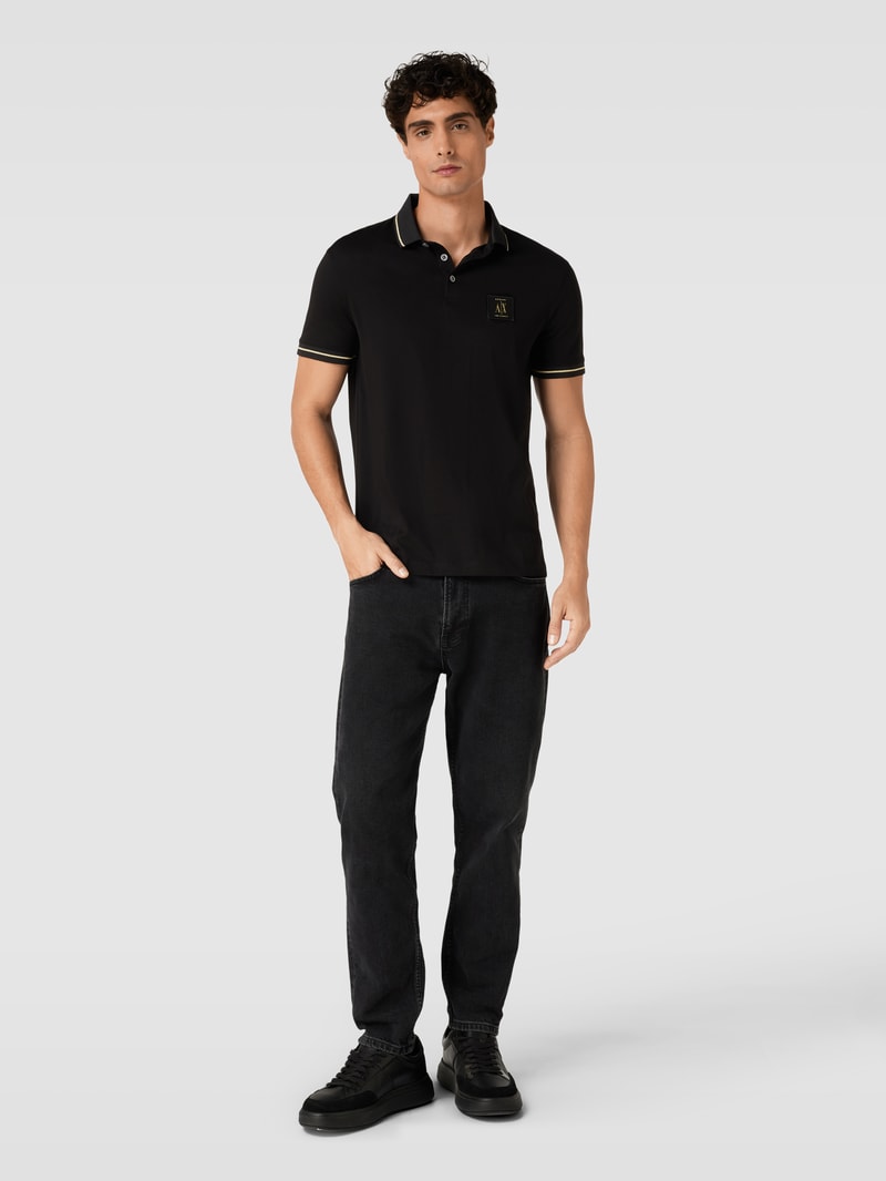 Poloshirt mit Label-Patch in schwarz