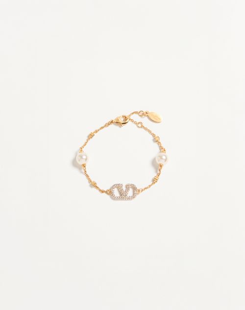 Pulseira com o logotipo V em metal, cristais Swarovski® e pérolas.