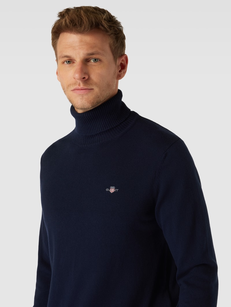Rollkragenpullover mit Label-Stitching aus Baumwoll-Woll-Mix in marineblau