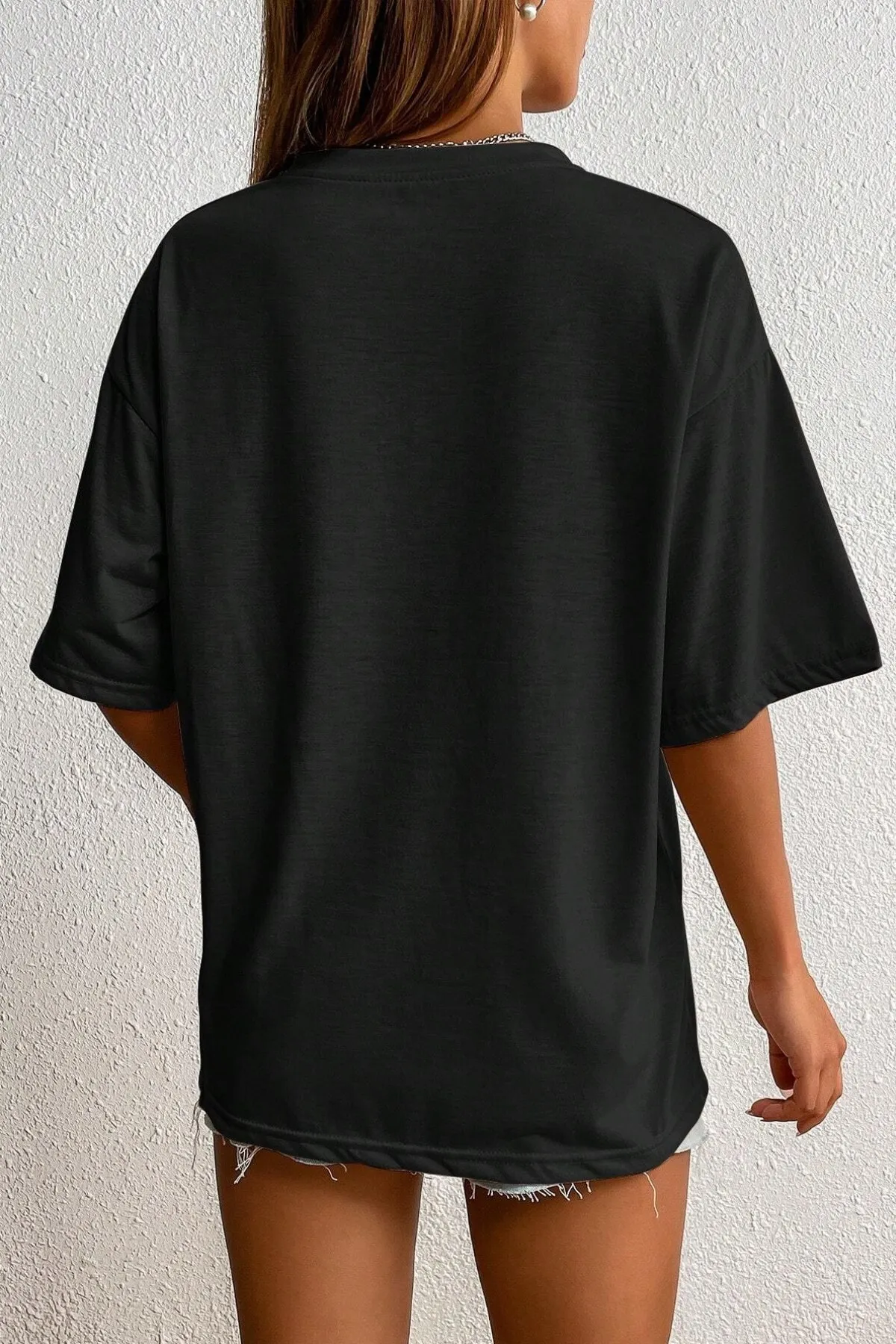 MODAGEN  Schwarzes Oversize-T-Shirt mit Rundhalsausschnitt und Smile-Print für Unisex