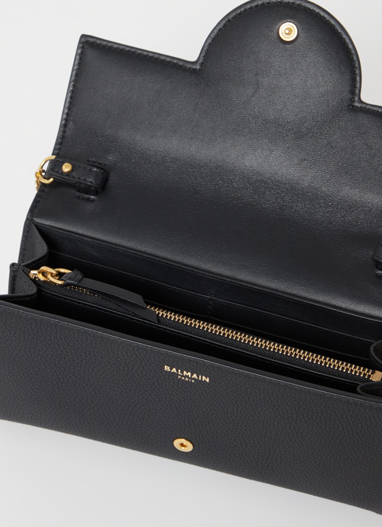 Clutch Balmain B-Buzz em pele de vitelo com alça de ombro removível.