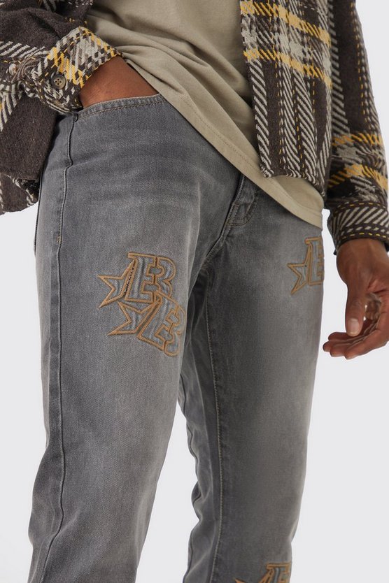 Zerrissene Slim-Fit Jeans mit Applikation