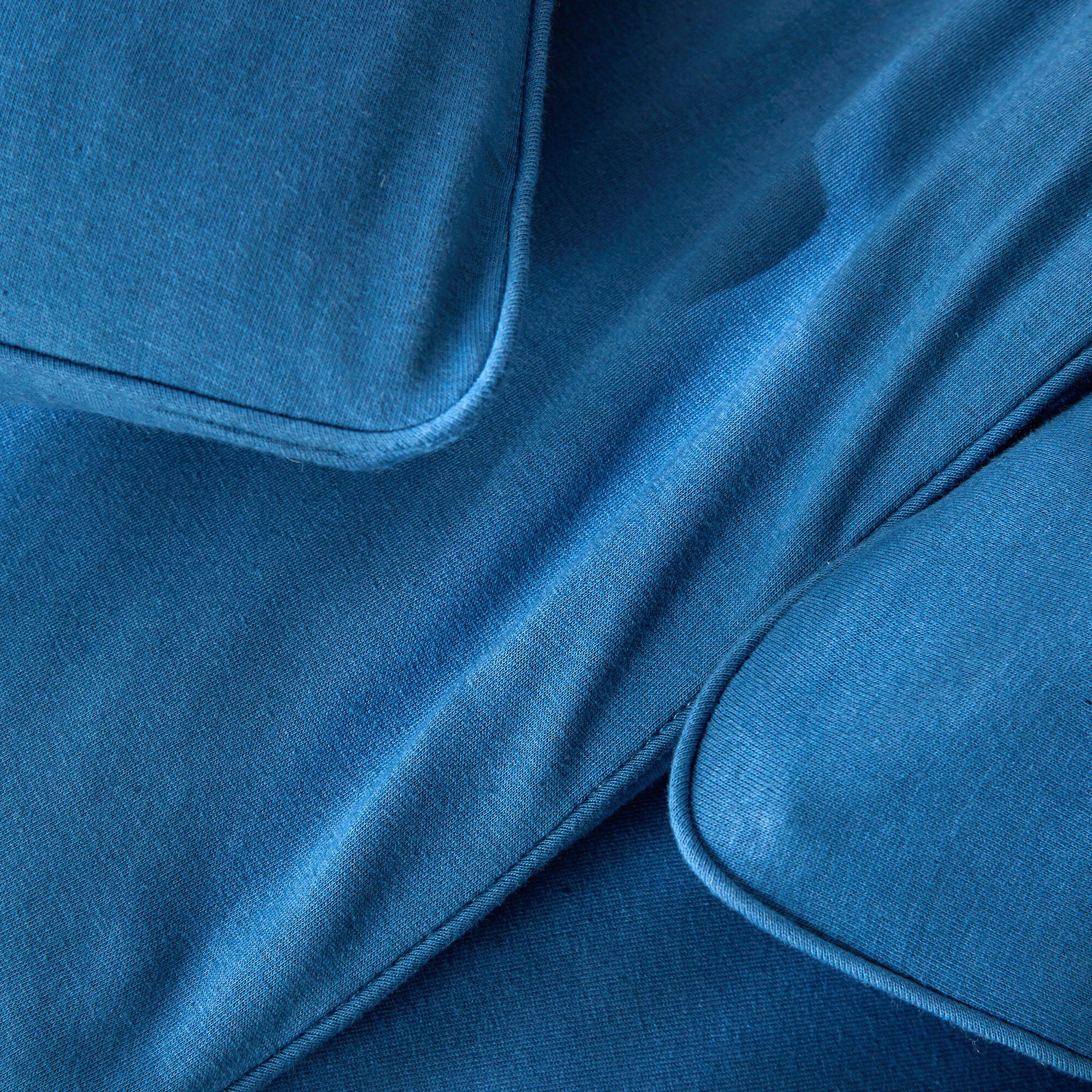 Linge de lit uni en jersey passepoilé coton