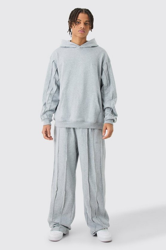 Oversize Trainingsanzug mit rohem Saum, Man Signature Stickerei und Kapuze