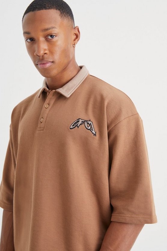 Kastiges Oversize Poloshirt mit Stickerei