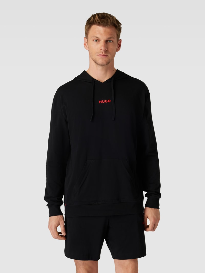 Hoodie in unifarbenem Design mit Känguru-Tasche in schwarz