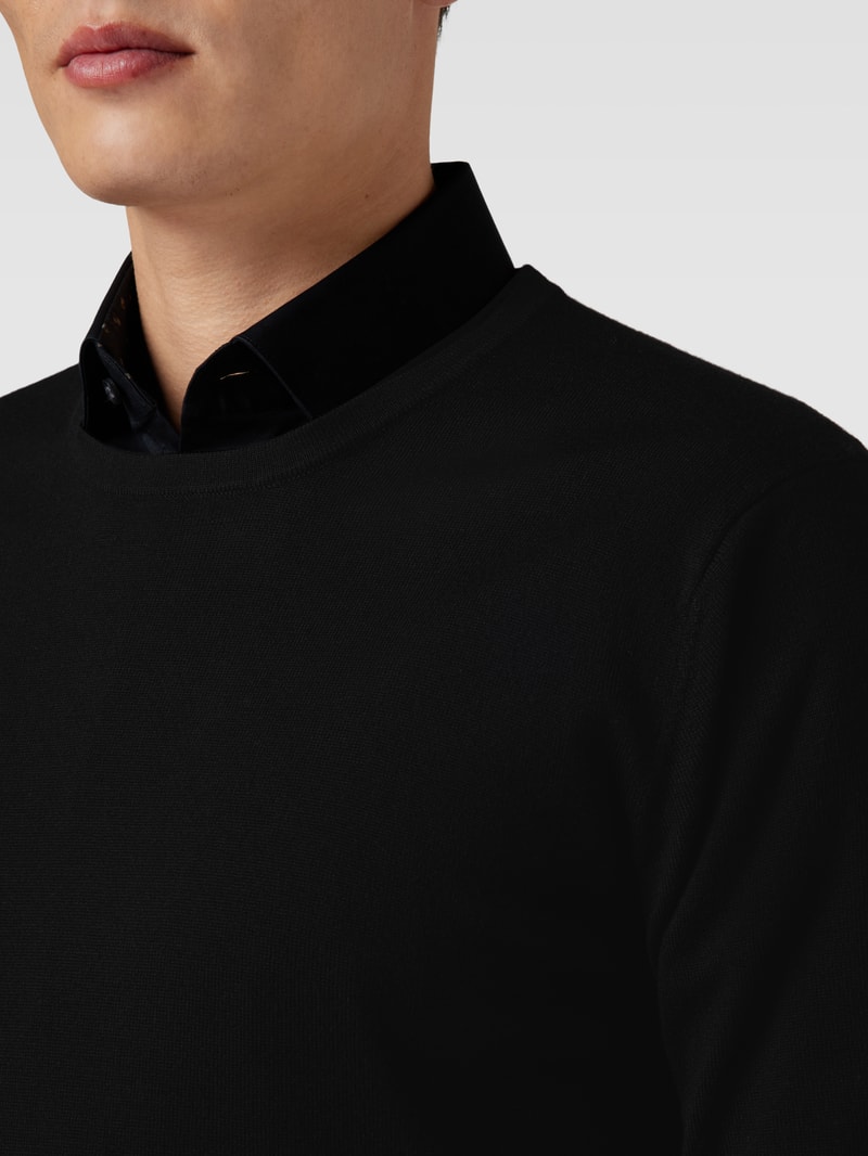 Strickpullover aus Wolle mit Rundhalsausschnitt in schwarz