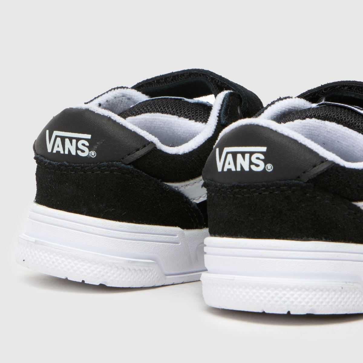 Vans svarta och vita Hylane v småbarnsskor