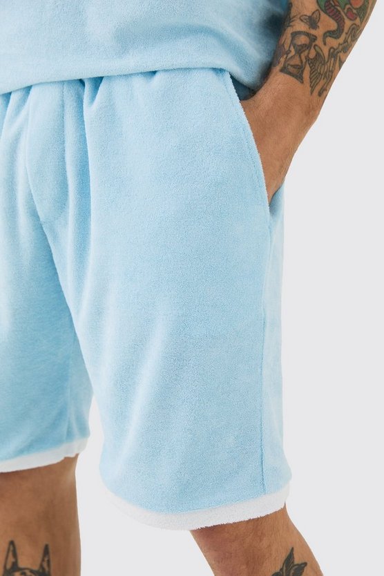 Lockere Frottee-Shorts mit Kontrast