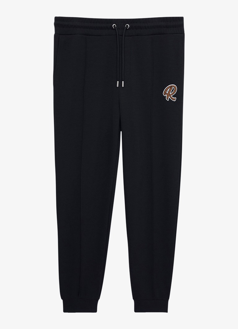 Pantaloni de trening conici Reiss Premier cu buzunare laterale.
