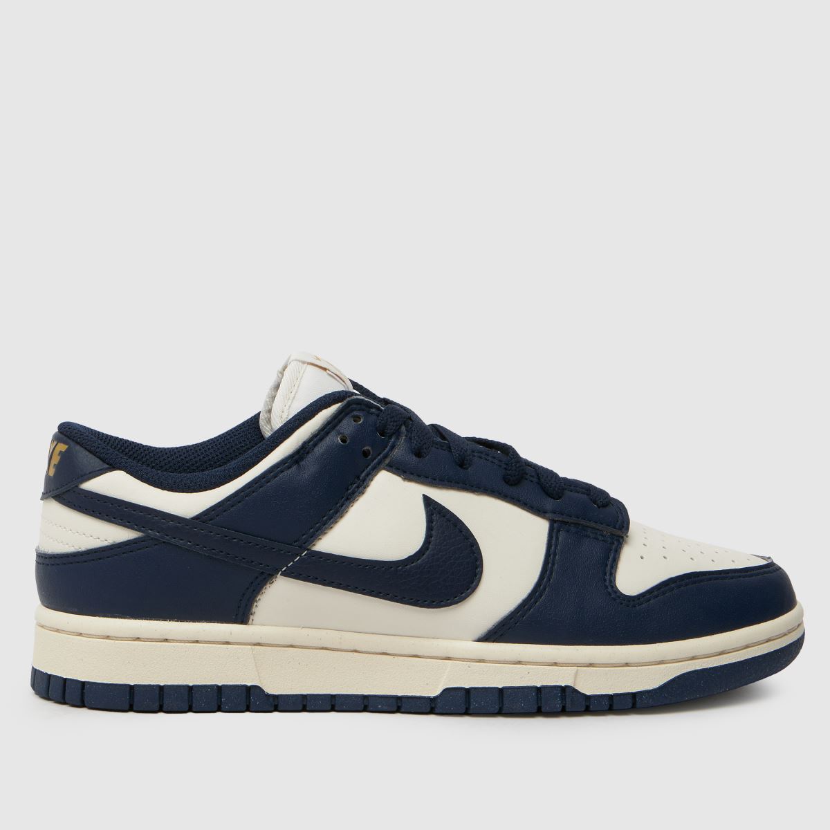 Nike Dunk Low-sneakers i elfenbensfärgad och marinblå