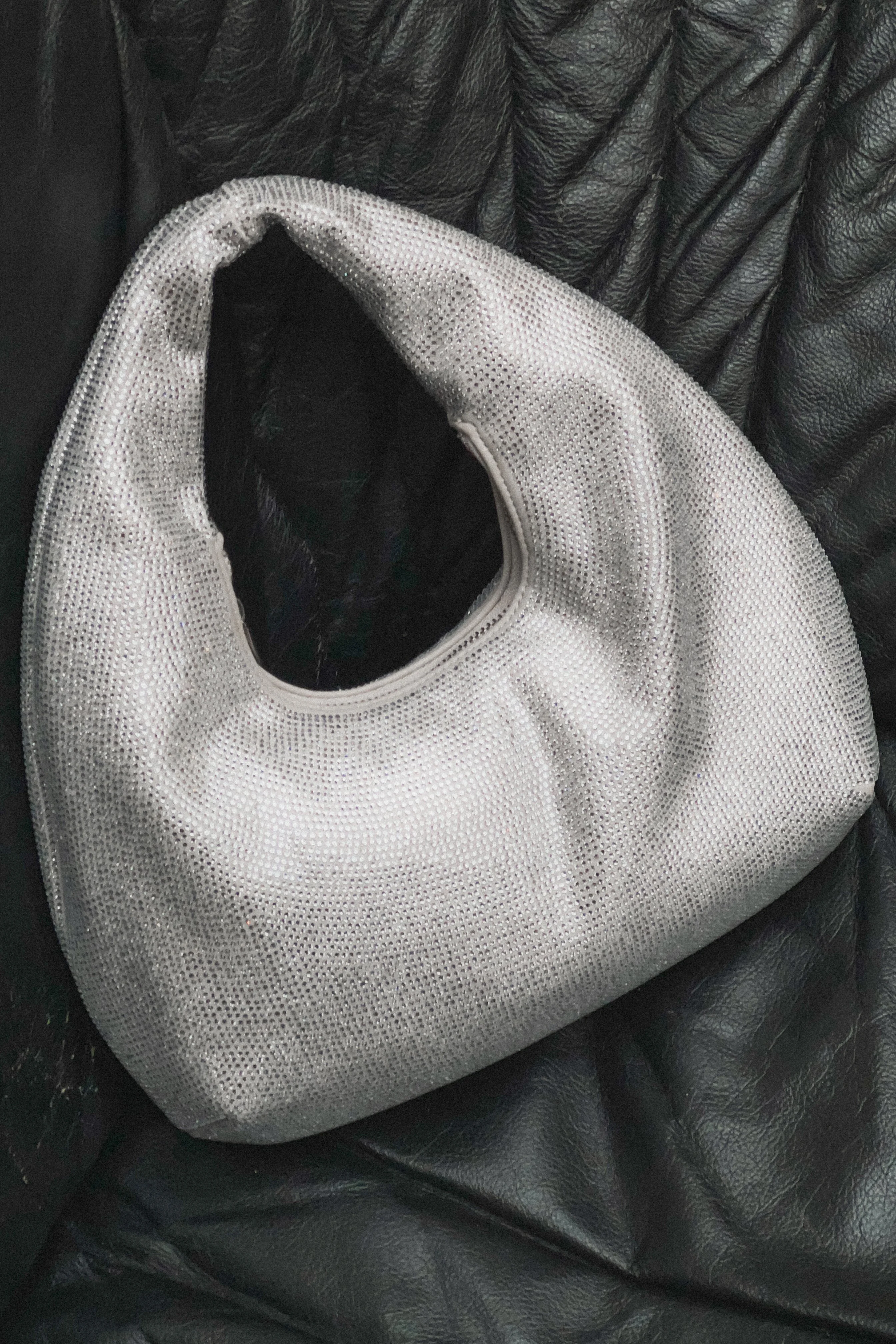 Glitzernde abgerundete Tasche