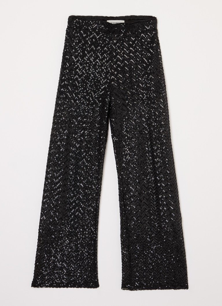 Calças de cintura alta e modelagem solta com lantejoulas, da marca Sofie Schnoor.