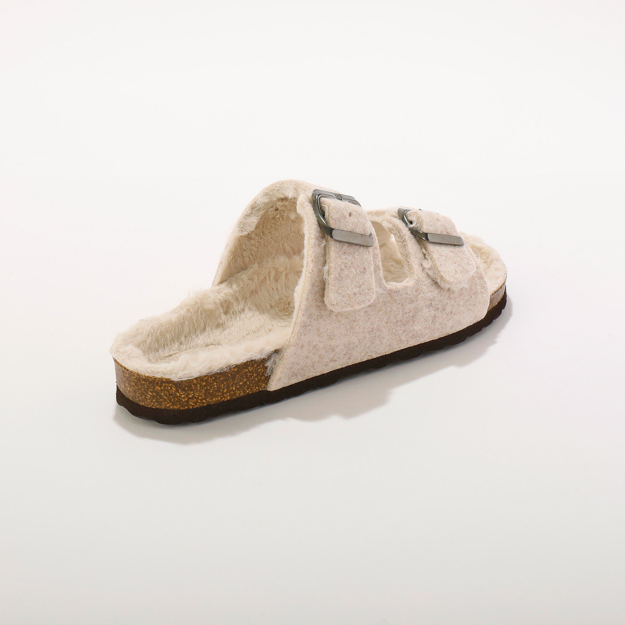 Mules fourrées à boucles