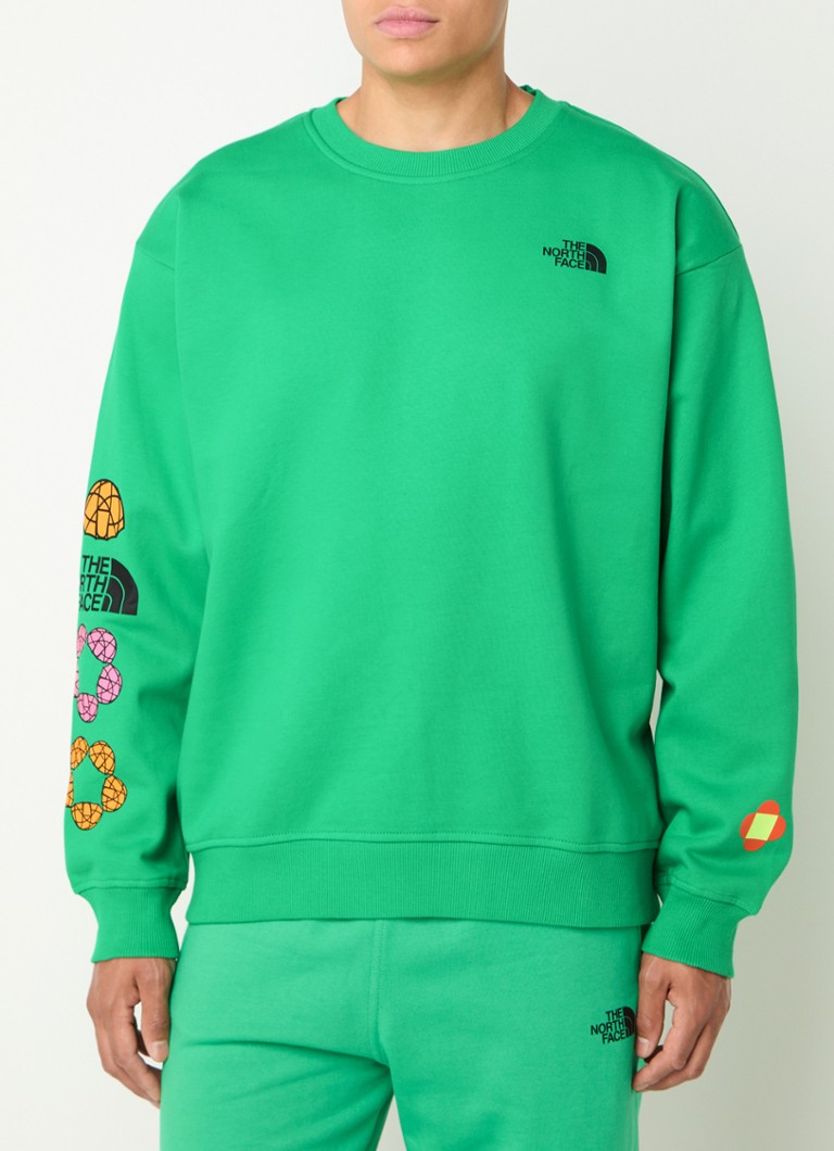 The North Face TNF x Yinka Ilori -neulepaita logopainatuksella