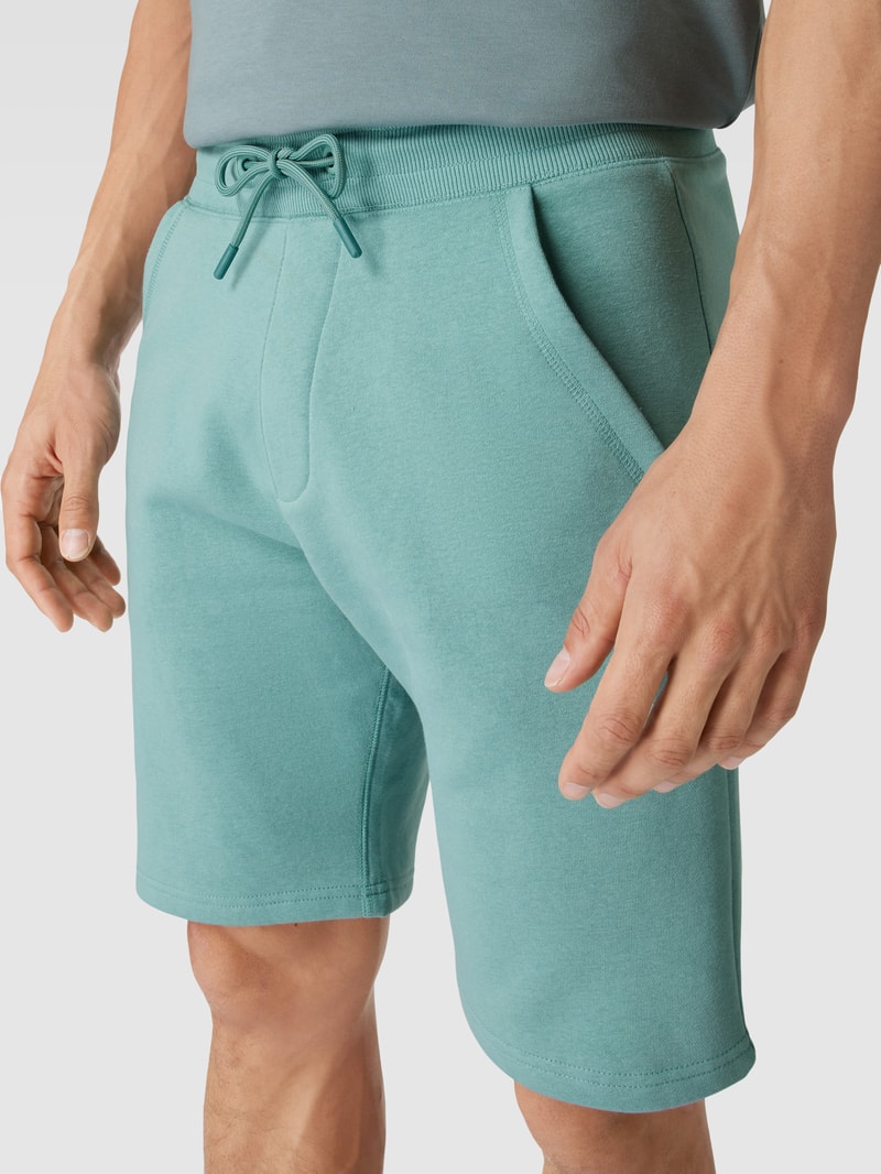 Sweatshorts mit französischen Eingrifftaschen in helltürkis