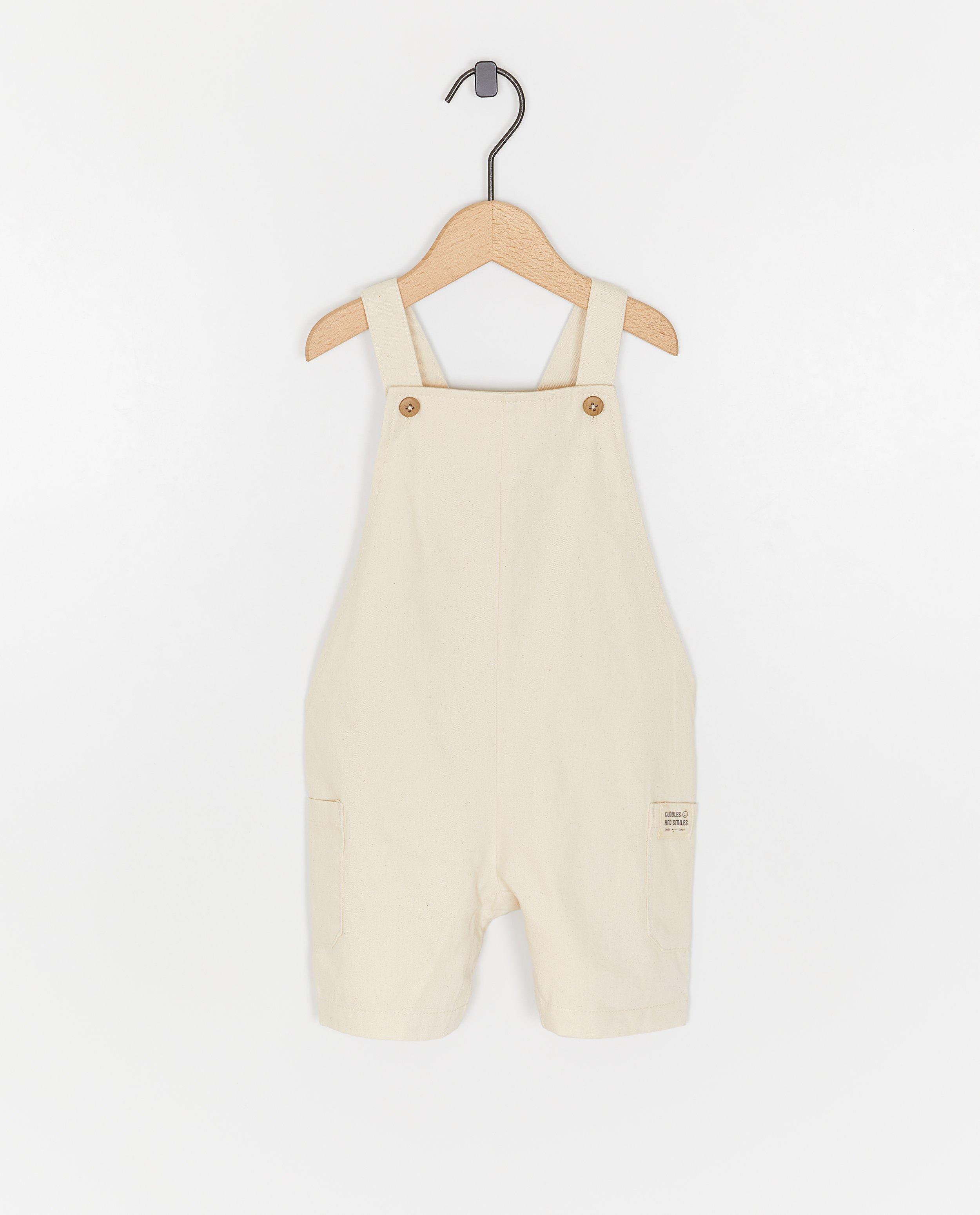 Cuddles and Smiles Beige salopette vit