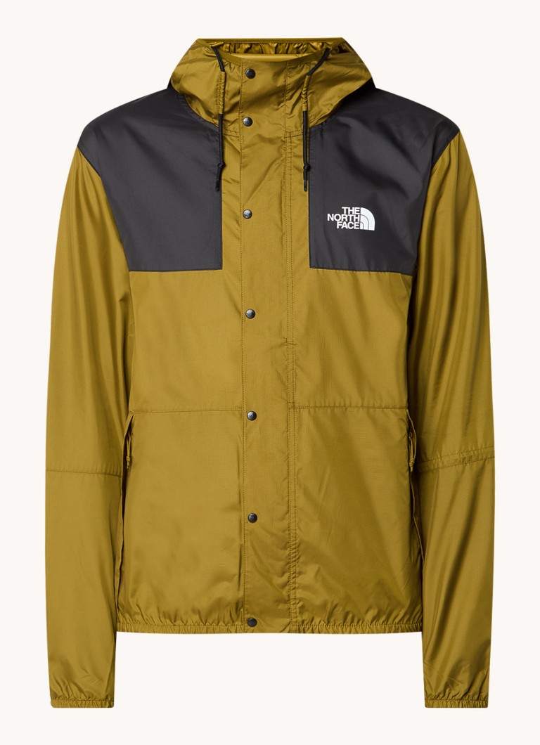 Vjetrovka The North Face s kapuljačom i džepovima na patentnom zatvaraču