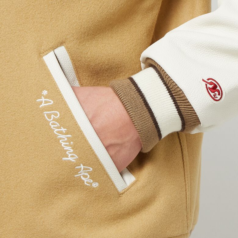 A Bathing Ape Multi Motif Varsity Jacket beige
