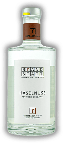Reisetbauer Brandstatt Haselnussgeist Reisetbauer Brandstatt Haselnussgeist Dieser Haselnussgeist von Reisetbauer Junior aus der Selektion Brandstatt zeichnet sich durch außerordentliche Reinheit und Klarheit aus. 0,7	 Liter - Vol 40%