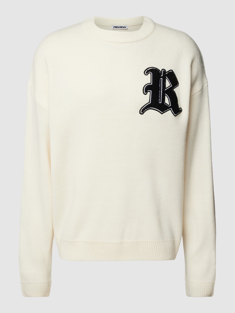 Strickpullover mit Label-Patch und überschnittenen Schultern in ecru