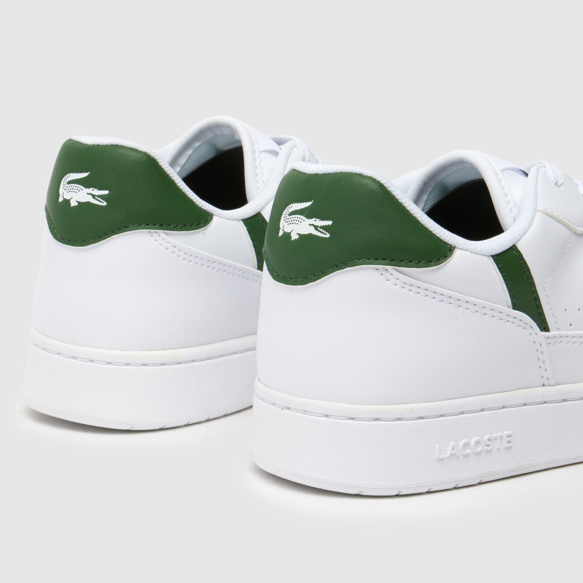 Lacoste vita och gröna t-clipsset för pojkar och ungdomar