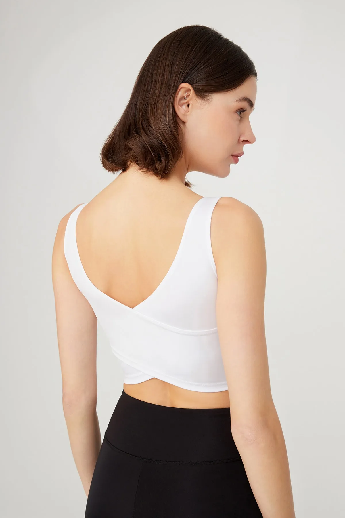 LOS OJOS  Weißes, leicht unterstütztes Bustier-Crop-Top mit Ausschnitt am Rücken