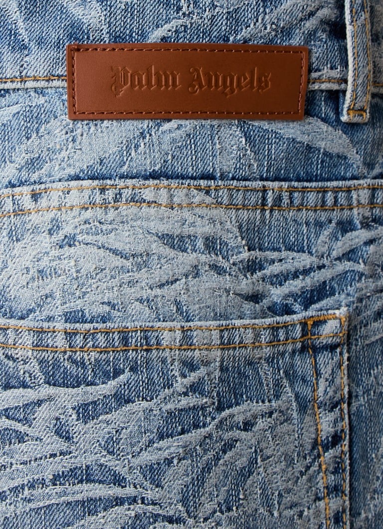 Blugi cu croială largă de la Palm Angels, cu imprimeu tropical.