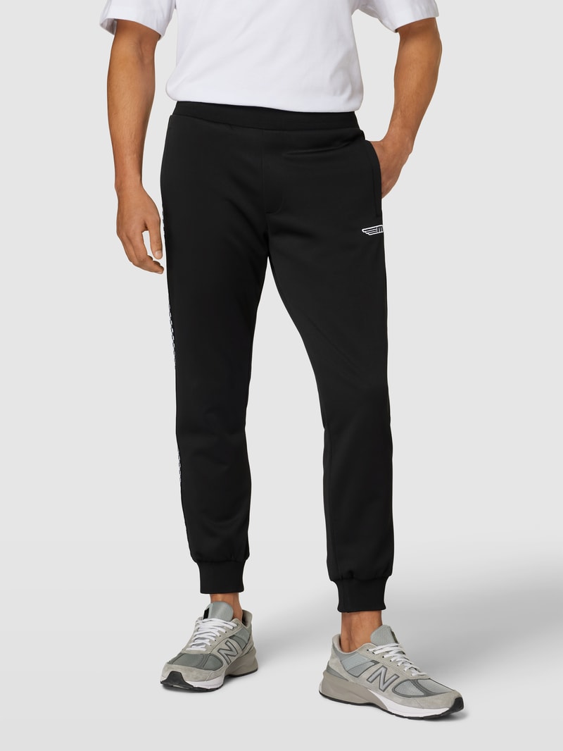 Sweatpants mit Label-Patch in schwarz