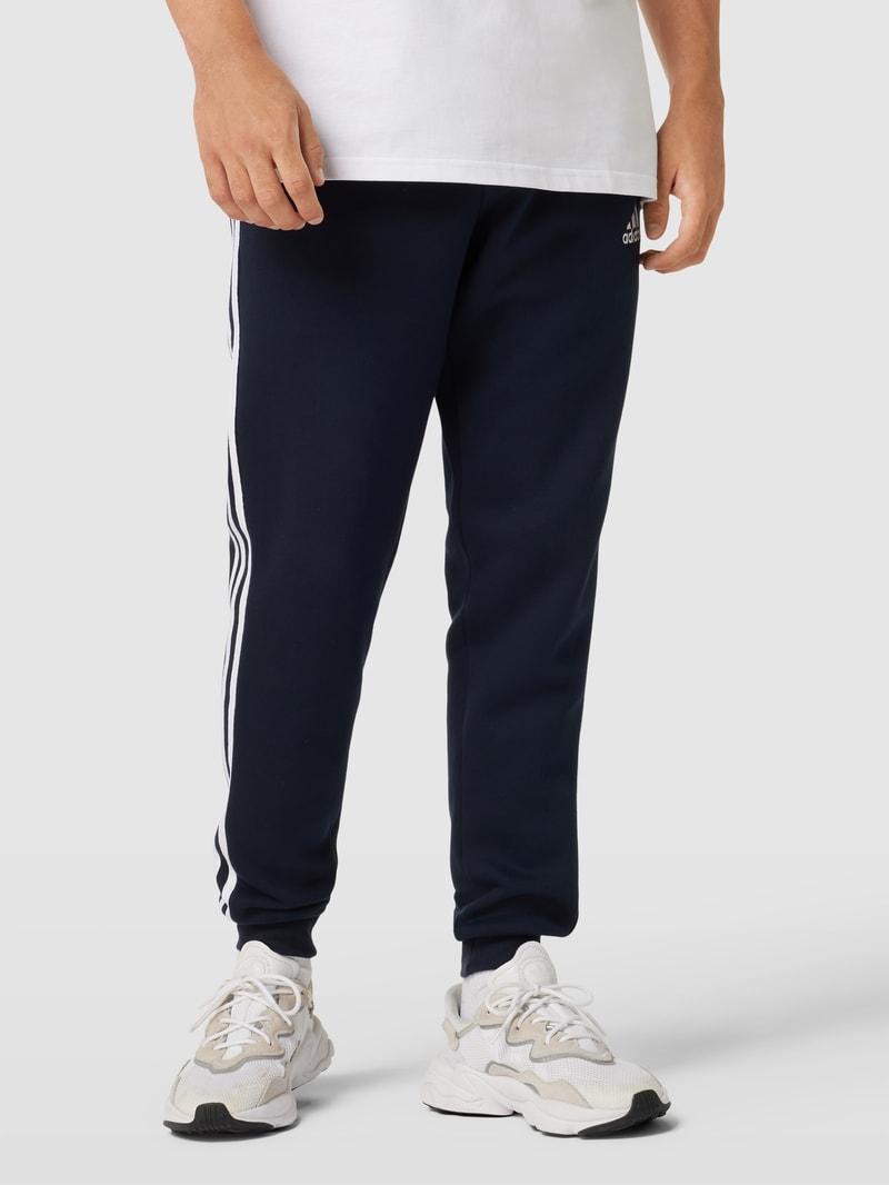 Sweatpants mit labeltypischen Galonstreifen in marineblau