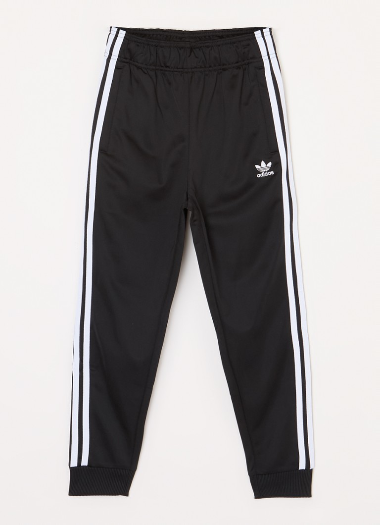 Teplákové kalhoty Adidas zúženého střihu s výšivkou loga