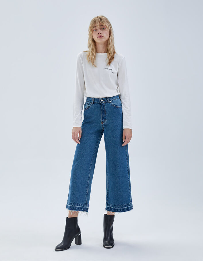 Jean large bleu taille haute 7/8e bas frangés Femme