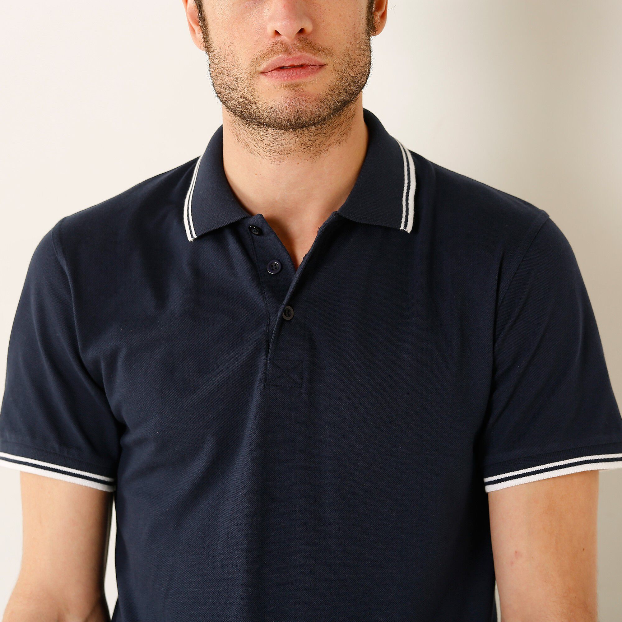 Polo uni maille piquée manches courtes