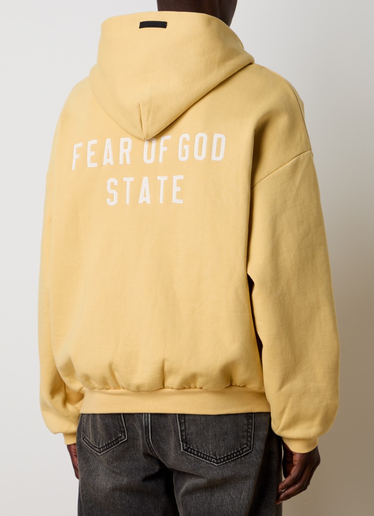 Dukserica Fear of God Essentials s printom na leđima i kapuljačom
