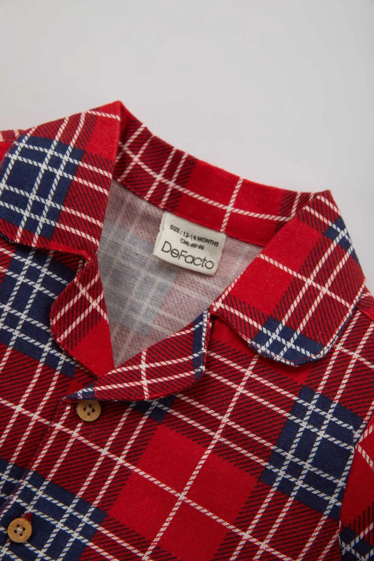 DeFacto  Baby-Jungen-Pyjama-Set aus kariertem Flanell mit Neujahrsmotiv und langen Ärmeln