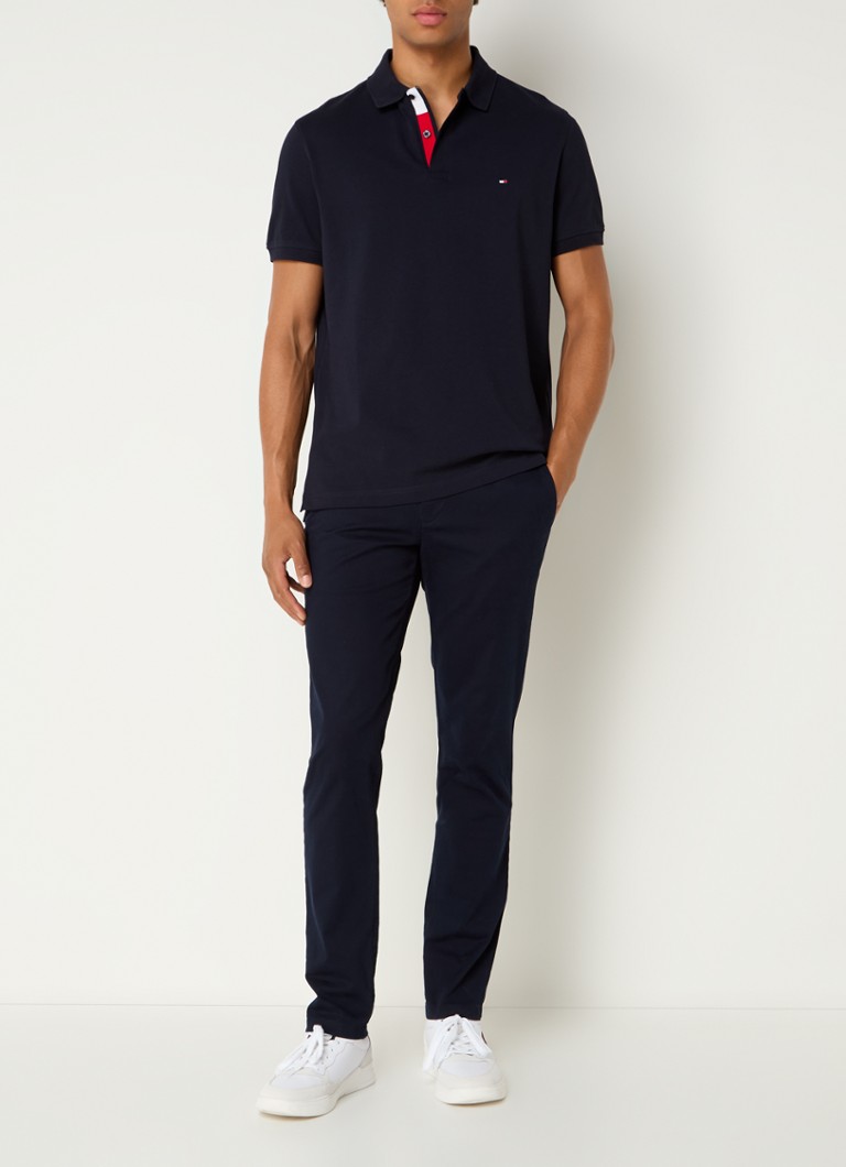 Polo Tommy Hilfiger de corte regular, confeccionada em algodão piqué com bordado do logotipo.