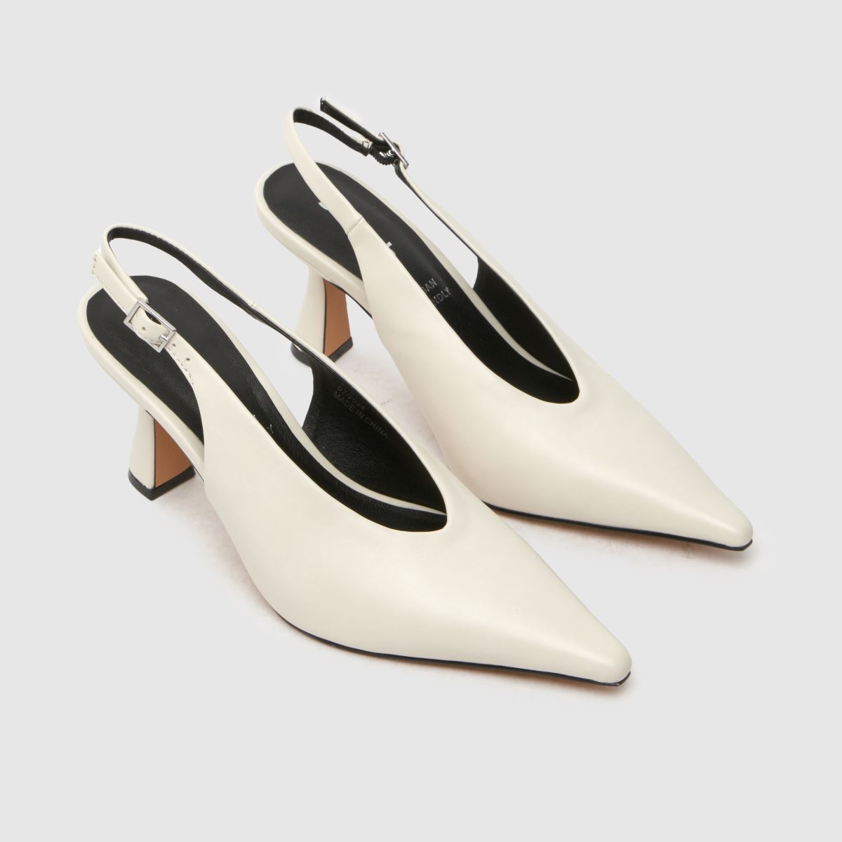 Schuh – Saber – Vita höga klackar med slingback-motiv