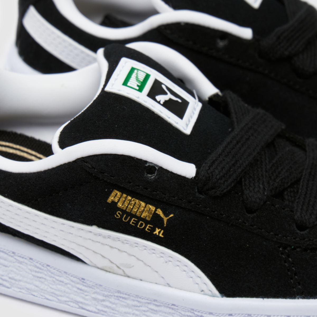 PUMA svarta och vita mocka XL småbarnssneakers