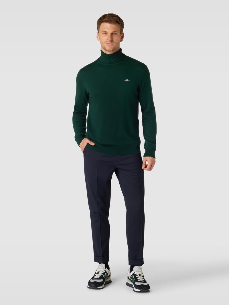 Rollkragenpullover mit Label-Stitching aus Baumwoll-Woll-Mix in dunkelgrün