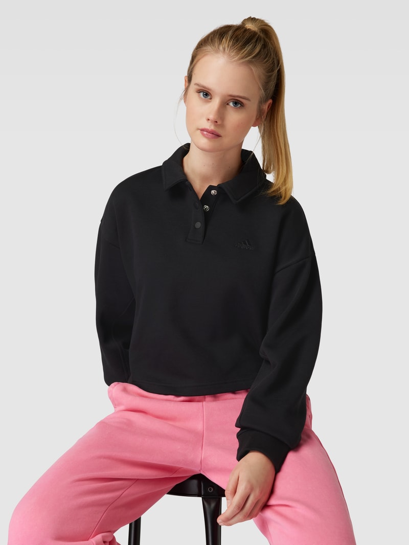 Cropped Sweatshirt mit rückseitigem Label-Print in schwarz