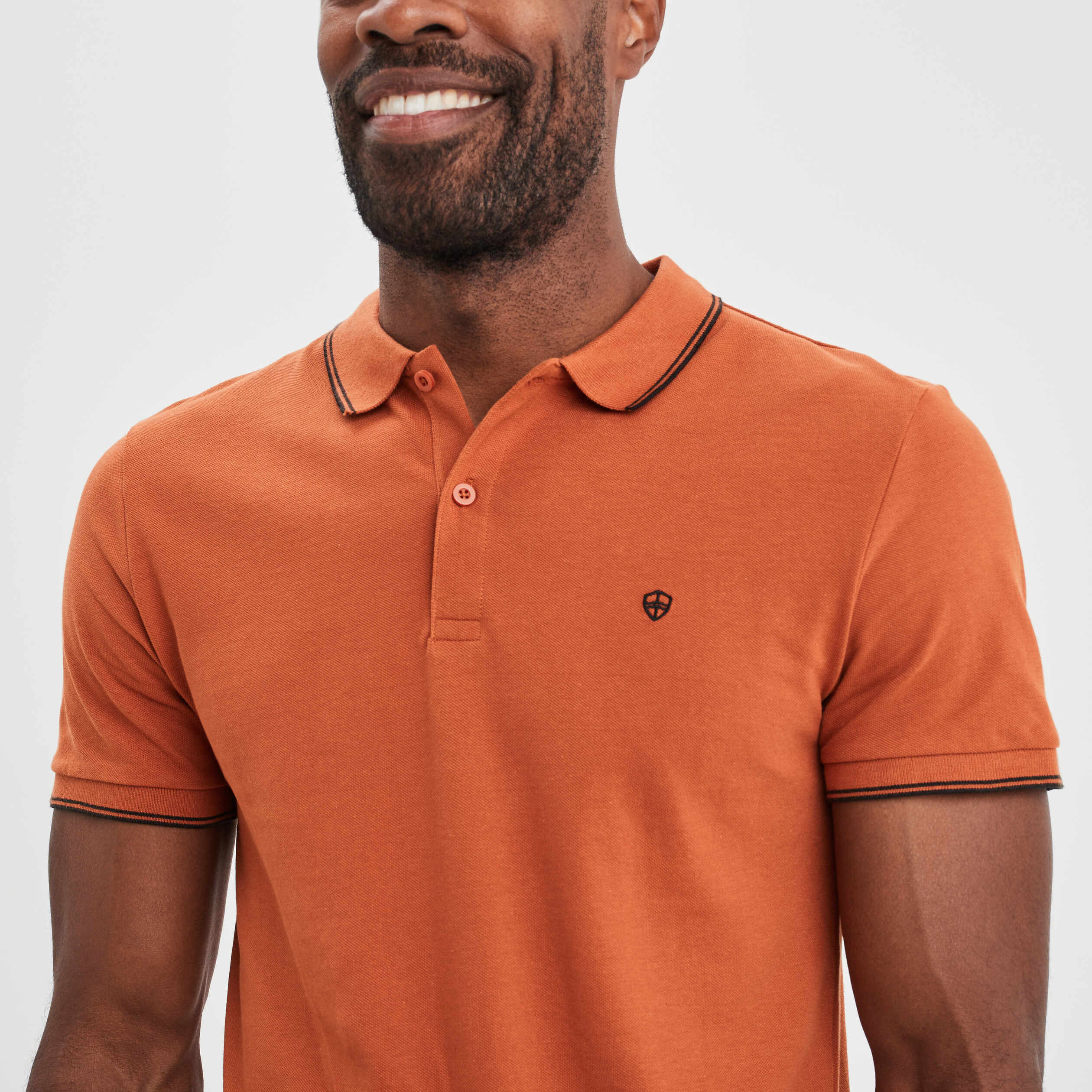 Polo manches courtes bords contrastés orange foncé homme | La Halle