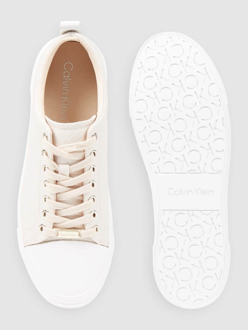 Sneaker mit Logo-Muster in beige
