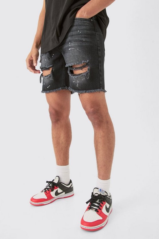 Schwarze Slim-Fit Jeansshorts mit Rissen und Farbspritzern