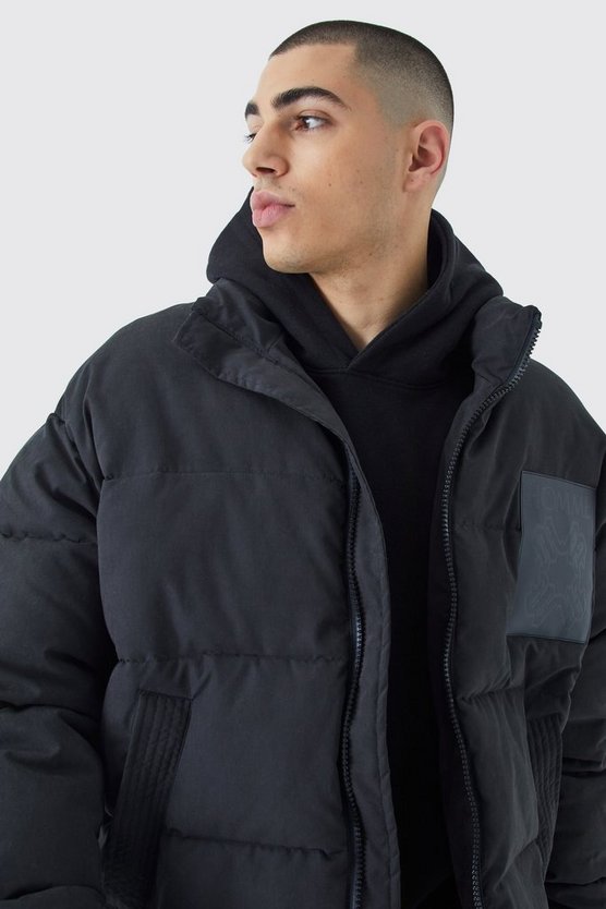 Kastige Oversize Nylon-Steppjacke mit PU-Aufnäher