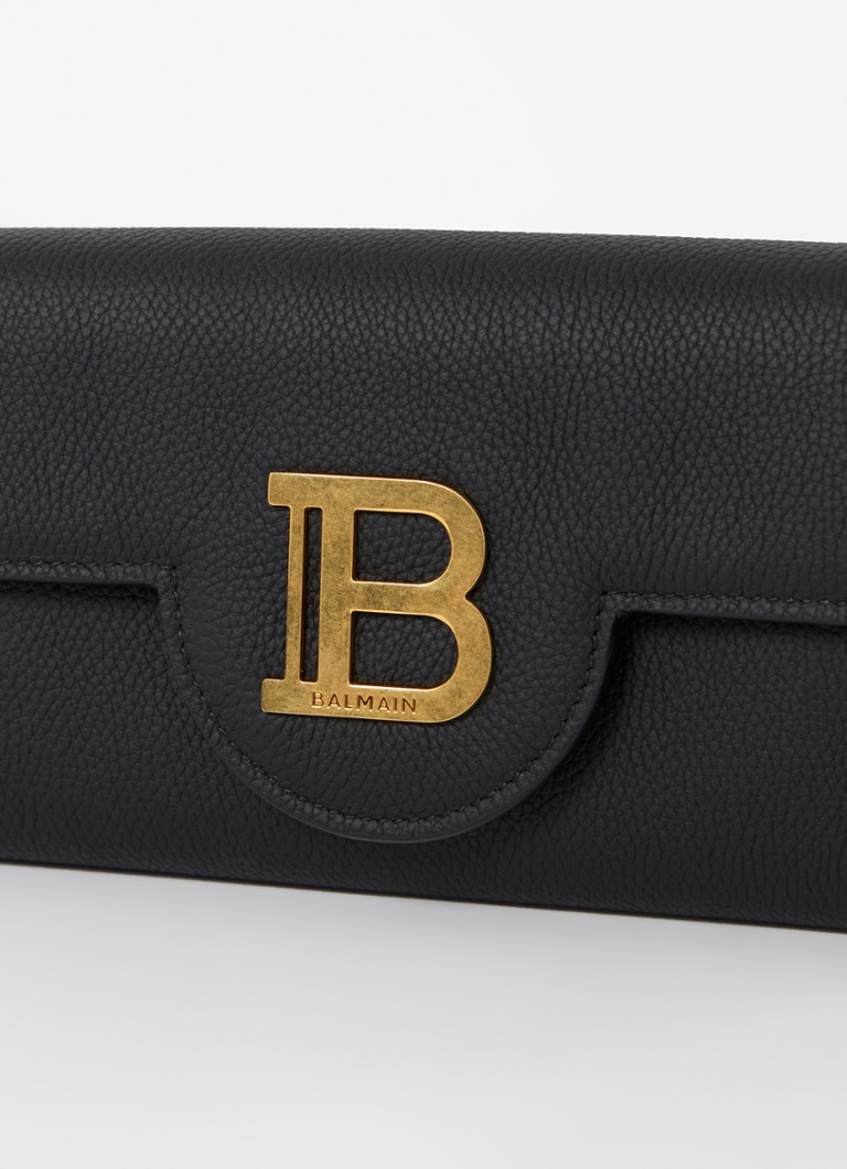 Clutch Balmain B-Buzz em pele de vitelo com alça de ombro removível.